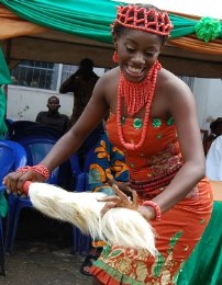 Young woman dancing in traditional Igbo style